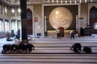 Worshippers pray at a mosque in Doha, Qatar, Thursday, Nov. 24, 2022. (AP Photo/Jorge Saenz)