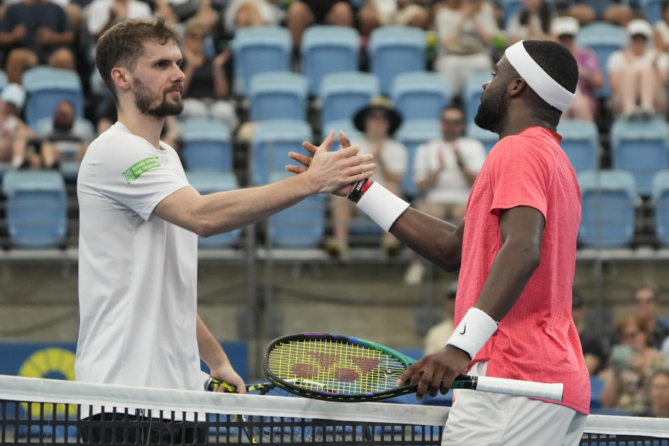 United States' Frances Tiafoe, right, is congratulated by Germany's Oscar Otte following during their Group C match at the United Cup tennis event in Sydney, Australia, Tuesday, Jan. 3, 2023. (AP Photo/Mark Baker)