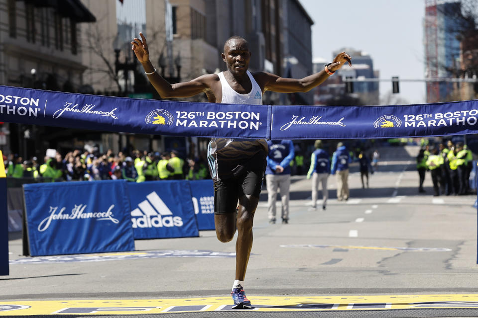 Evans Chebet, of Kenya, hits the finish line to win the 126th Boston Marathon, Monday, April 18, 2022, in Boston. (AP Photo/Winslow Townson)