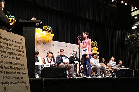 Shrey Parikh, representing Day Creek Intermediate School, tackles the challenge of spelling on stage at the San Bernardino Valley College auditorium, Mar. 13.