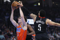 Oklahoma City Thunder guard Josh Giddey (3) grabs a rebound next to Houston Rockets guard Fred VanVleet (5) during the first half of an NBA basketball game Wednesday, March 27, 2024, in Oklahoma City. (AP Photo/Nate Billings)