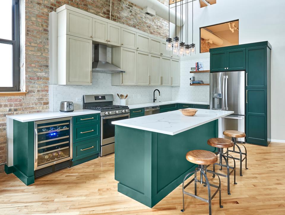 123 Remodeling devised a complete kitchen renovation with captivating emerald green cabinetry.