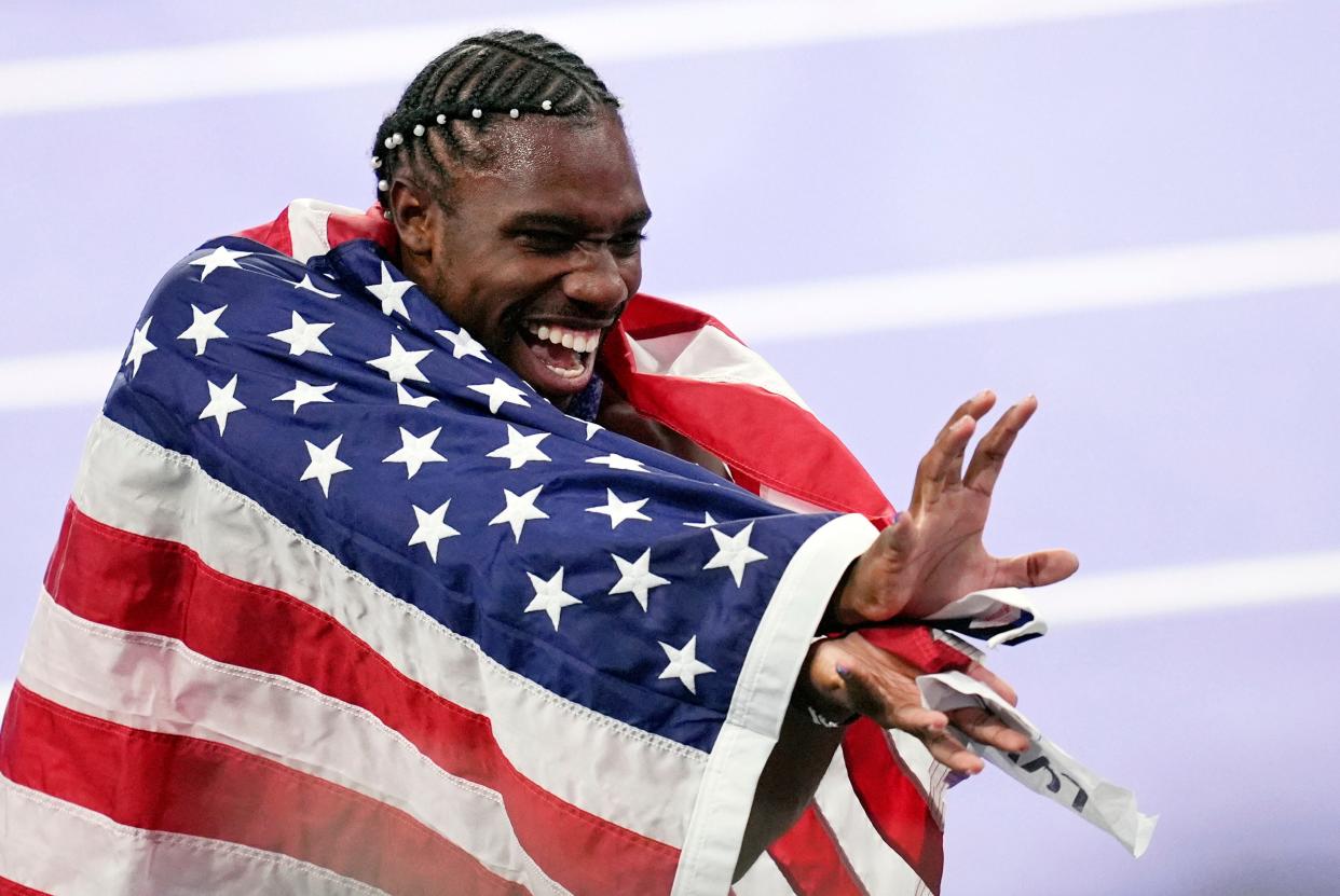 Noah Lyles celebrates after winning the men’s 100-meter dash.