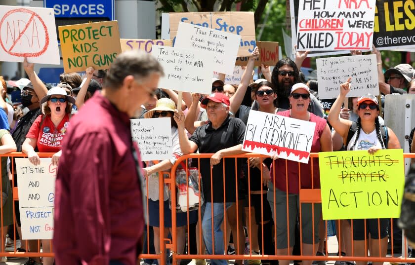 Houston, Texas May 27, 2022- Protestors yell at a man leaving the NRA Convention outside the George R. Brown Convention Center in Houston Friday a few days after the Robb Elementary school shooting in Uvalde, Texas.