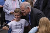 Australian Prime Minister Scott Morrison poses for a selfie after voting in his electorate of Cook in Sydney, Australia, Saturday, May 21, 2022. Australians go to the polls Saturday following a six-week election campaign that has focused on pandemic-fueled inflation, climate change and fears of a Chinese military outpost being established less than 1,200 miles off Australia's shore.(AP Photo/Mark Baker)