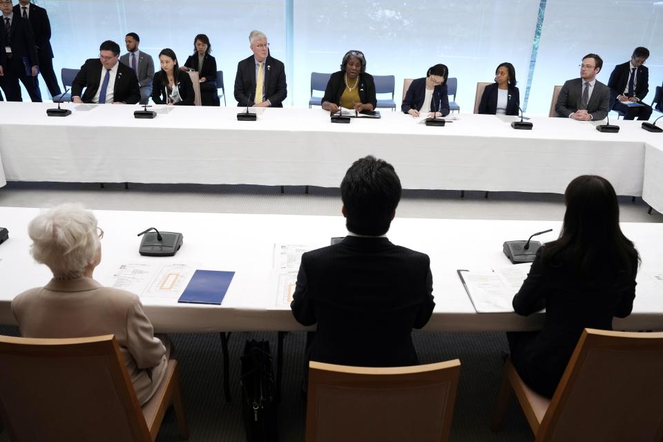 U.S. Ambassador to United Nations Linda Thomas-Greenfield, center top, meets with Japan's Chief Cabinet Secretary Yoshimasa Hayashi and the families of abduction victims by North Korea Thursday, April 18, 2024, at prime minister's office in Tokyo. (AP Photo/Eugene Hoshiko, Pool)