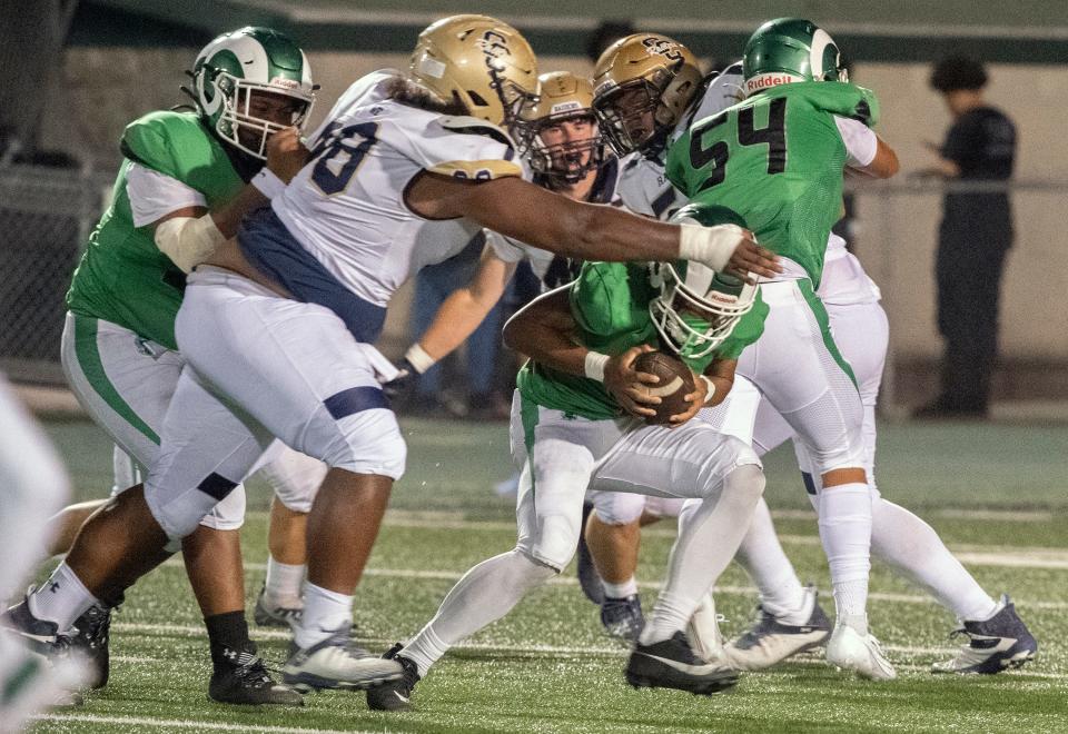 St. Mary's Samson Hunkin, right is tackled by Central Catholic's Troy Leota during the so-called "Holy Bowl" varsity football game at St. Mary's Sanguinetti Field in Stockton on Aug. 25, 2023.