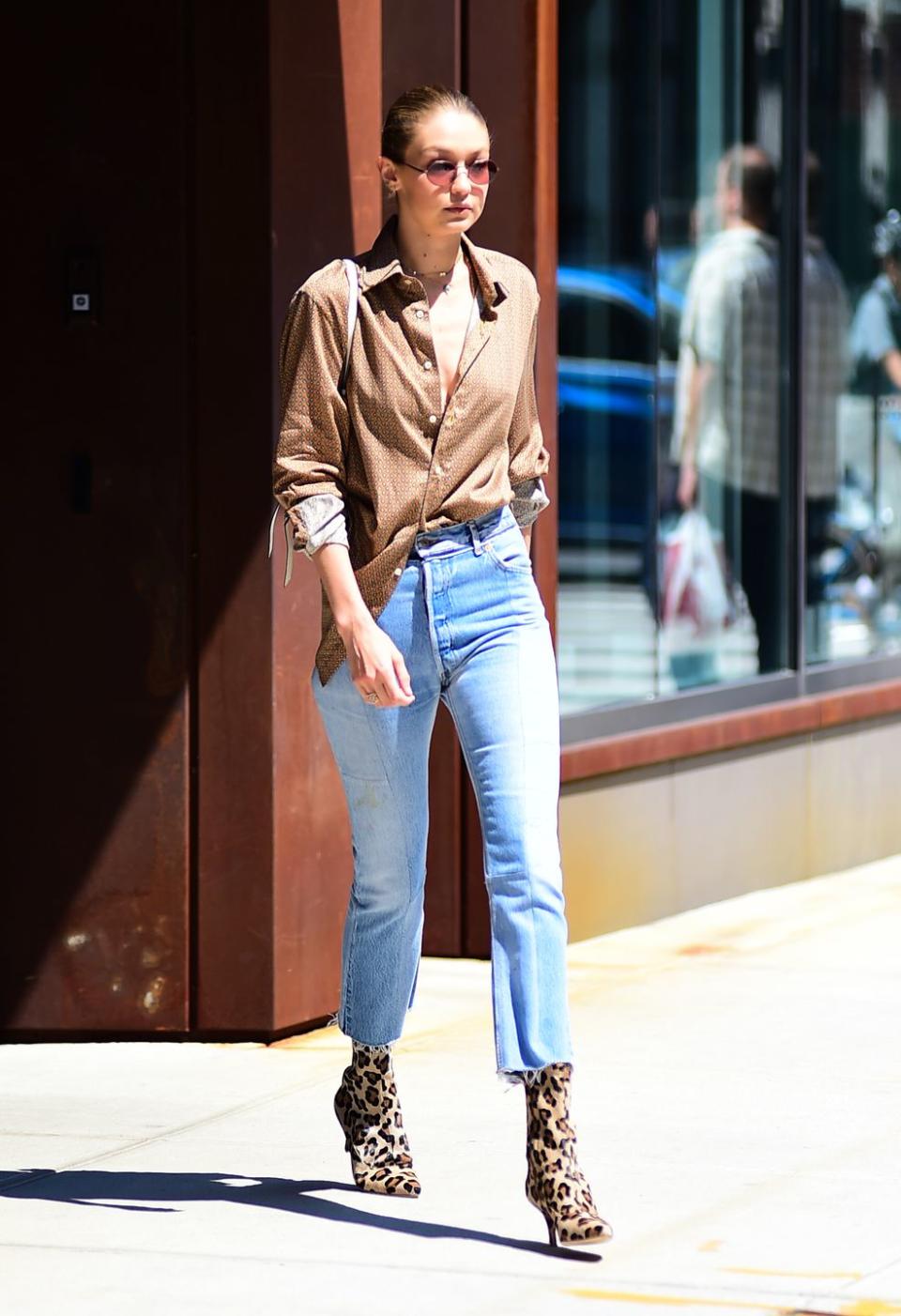 <p>I'm beginning to think that Gigi's closet is literally just a room full of mom jeans – and honestly I'm jealous af. She paired her faves with an androgynous button-up and the most badass booties you've ever seen. </p>