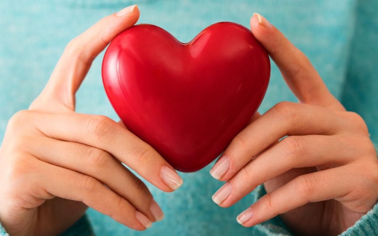 woman holding heart