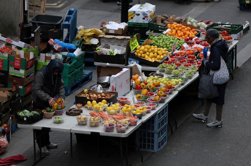 FILE PHOTO: A customer waits to be served at a stall on Surrey Street market in Croydon