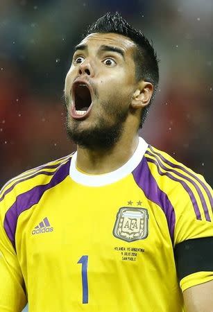 Argentina's goalkeeper Sergio Romero celebrates after saving the ball for the second time during a penalty shoot-out at their 2014 World Cup semi-finals against the Netherlands at the Corinthians arena in Sao Paulo July 9, 2014. REUTERS/Dominic Ebenbichler