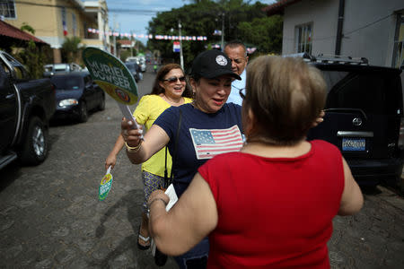 Emily Hernandez greets a friend on a street in Intipuca, El Salvador, August 14, 2018. REUTERS/Jose Cabezas