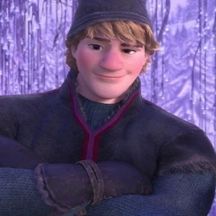 Kristoff from Disney's Frozen standing with a smirk and his arms crossed.