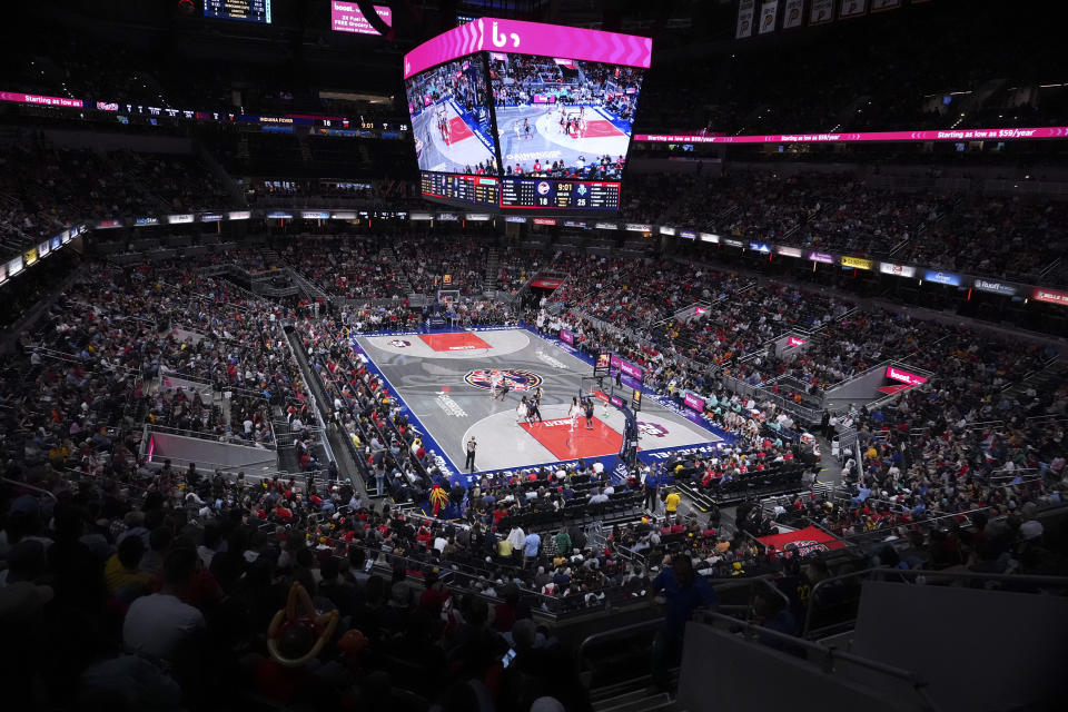 Fans watch in the first half of a WNBA basketball game between the Indiana Fever and the New York Liberty, Thursday, May 16, 2024, in Indianapolis. (AP Photo/Michael Conroy)