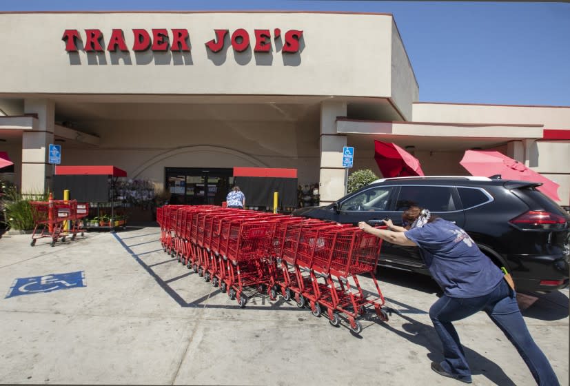 SHERMAN OAKS, CA -JULY 20, 2020: Shopping carts are returned to a collection area outside of Trader Joe's on Riverside Dr. In Sherman Oaks. Trader Joe's has responded to criticisms about its packaging by announcing that it is in the process of eliminating labels that use ethnic-sounding names intended to be humorous. The offending products bear such labels as Trader Ming's for foods and condiments related to Chinese cuisine, Trader Jose's for Mexican-style products and Trader Giotto's for Italian-themed items. (Mel Melcon / Los Angeles Times)