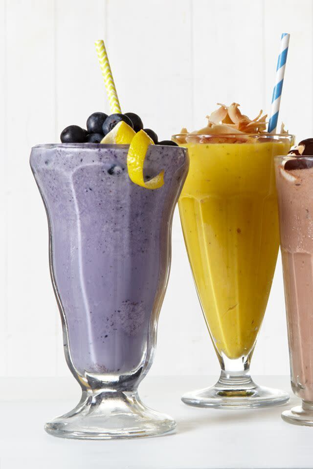 blueberry lemon and mango lassie shakes in sundae glasses