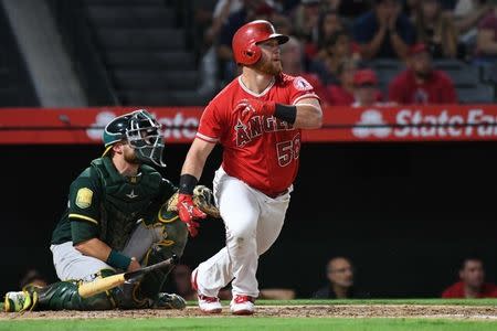 Aug 10, 2018; Anaheim, CA, USA; Los Angeles Angels right fielder Kole Calhoun (56) hits a two-run home run in the third inning against the Oakland Athletics at Angel Stadium of Anaheim. Mandatory Credit: Richard Mackson-USA TODAY Sports