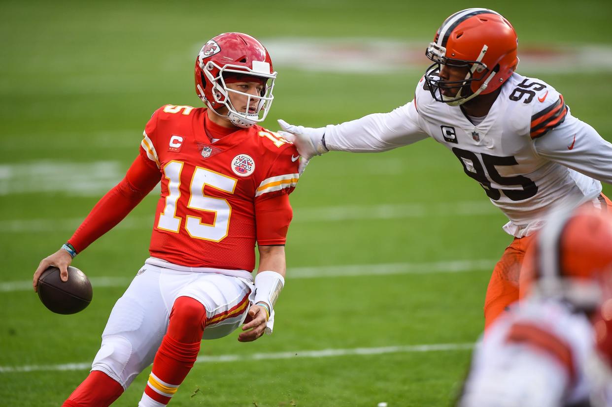 Chiefs quarterback Patrick Mahomes is pressured by Browns defensive end Myles Garrett in the first half Sunday, Jan. 17, 2021, in Kansas City, MO.