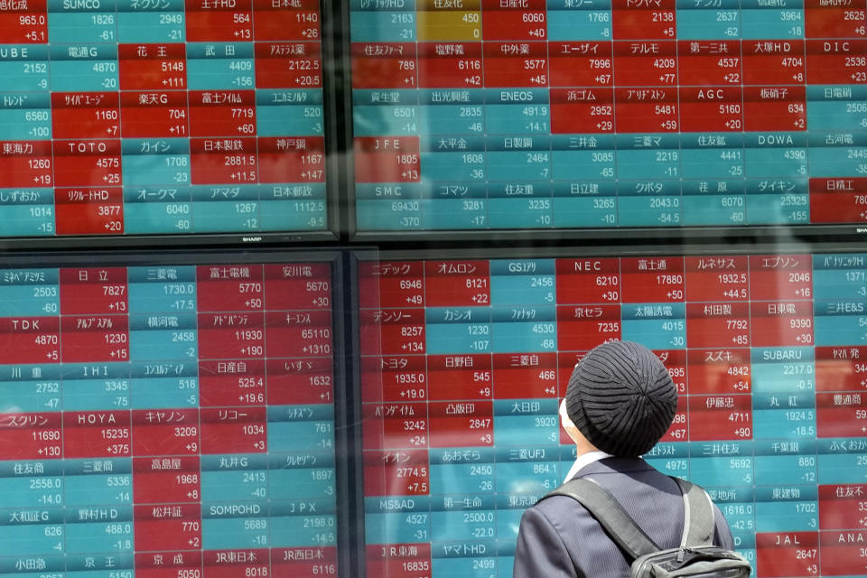 FILE - A person looks at an electronic stock board showing Japan's Nikkei 225 index at a securities firm in Tokyo, on May 12, 2023. Asian shares mostly rose Friday, June 9, 2023, led by a jump on the Tokyo Stock Exchange where share prices got a boost of optimism from a new bull market on Wall Street. (AP Photo/Eugene Hoshiko, File)