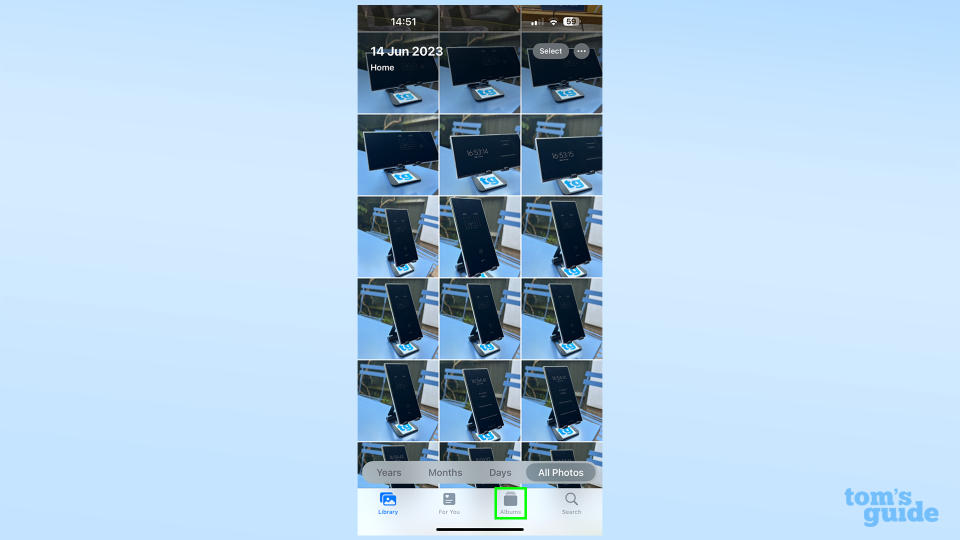 A screenshot showing where to find the Albums tab in iOS Photos