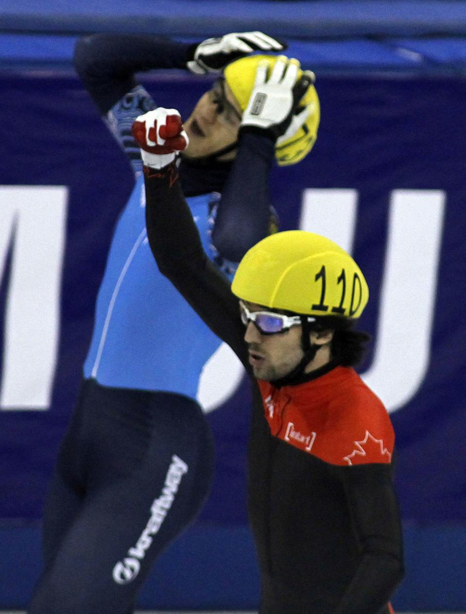 SHANGHAI, CHINA - DECEMBER 09: Charles Hamelin (R) of Canada celebrates as he defeats Vladimir Grigorev of Russia in the Men's 500m Final during the day two of the ISU World Cup Short Track at the Oriental Sports Center on December 9, 2012 in Shanghai, China. (Photo by Hong Wu/Getty Images)