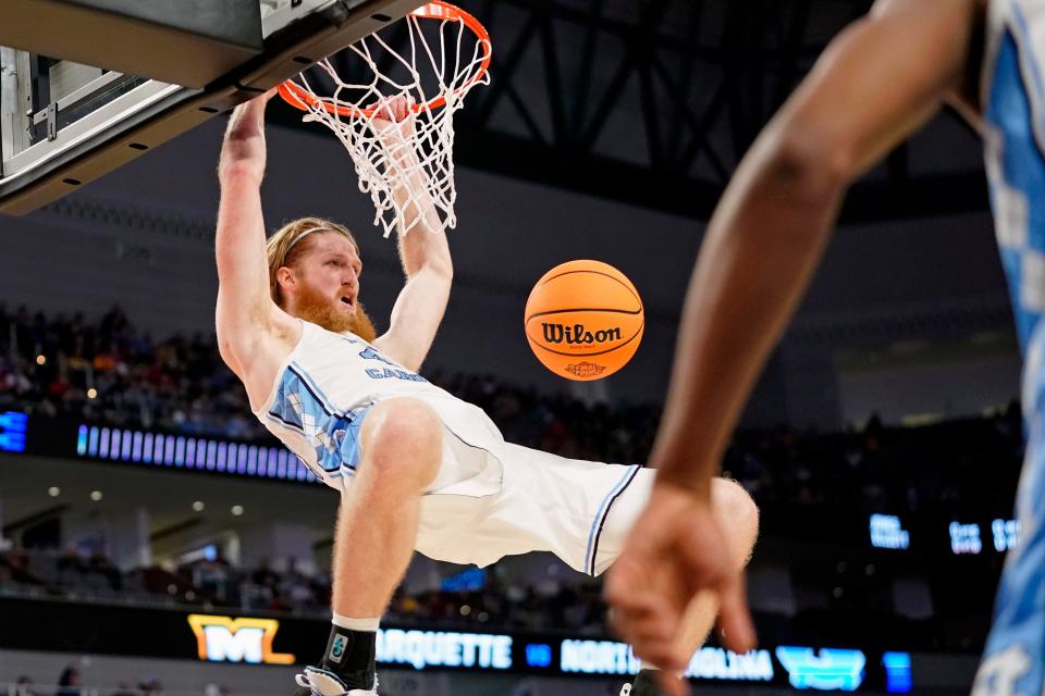 North Carolina forward Brady Manek dunks against Marquette during the first round of the NCAA Tournament at Dickies Arena in Fort Worth, Texas.