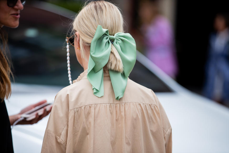 COPENHAGEN, DENMARK - AUGUST 08: A guest is seen wearing bow tie in her hair outside Lala Berlin during Copenhagen Fashion Week Spring/Summer 2020 on August 08, 2019 in Copenhagen, Denmark. (Photo by Christian Vierig/Getty Images)