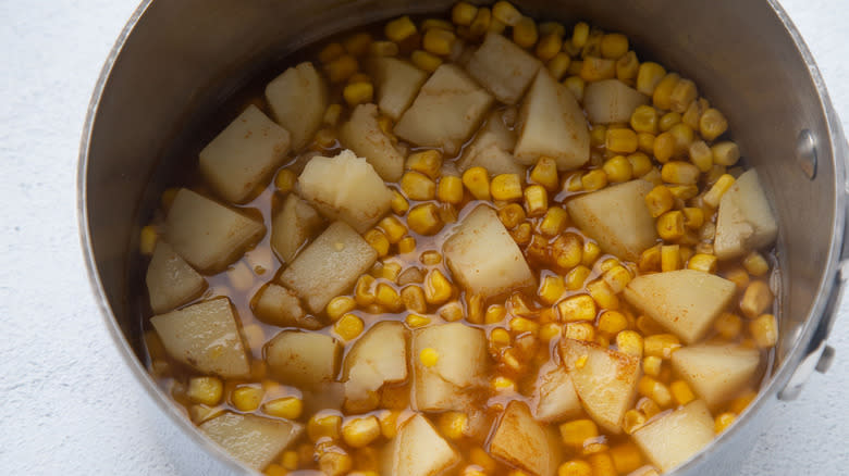 corn and potatoes in pot