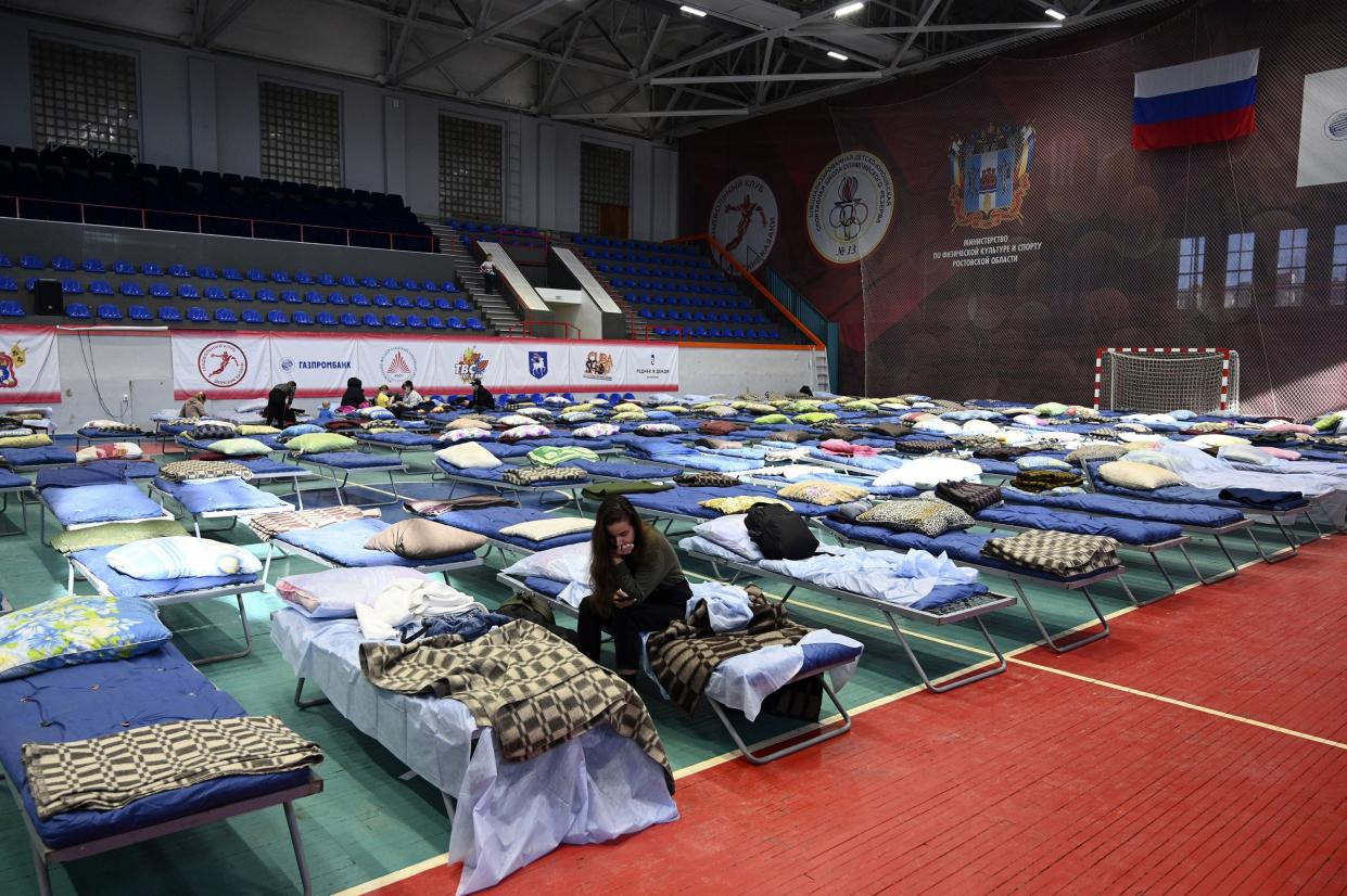 Displaced civilians from the Donetsk and Luhansk regions, the territory controlled by pro-Russia separatist governments in eastern Ukraine, rest in a sport hall in Taganrog, Russia, Monday, Feb. 21, 2022. World leaders are making another diplomatic push in hopes of preventing a Russian invasion of Ukraine, even as heavy shelling continues in Ukraine's east.