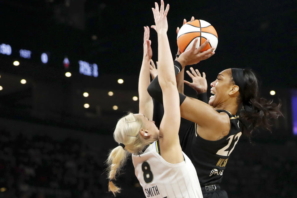 Las Vegas Aces forward A'ja Wilson (22) takes a shot over Chicago Sky forward Alanna Smith (8) during the first half of Game 2 of a WNBA basketball playoff series game, Sunday, Sept. 17, 2023, in Las Vegas. (Steve Marcus/Las Vegas Sun via AP)