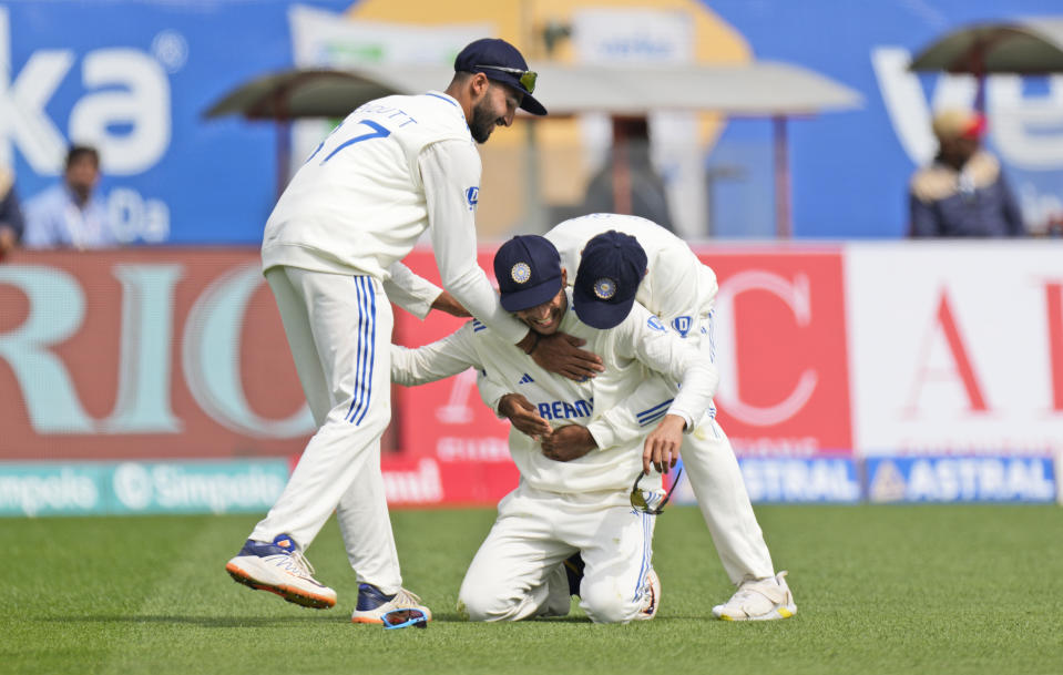 India's Jasprit Bumrah, right, and Devdutt Padikkal congratulate teammate Shubman Gill for taking the catch of England's Ben Duckett on the first day of the fifth and final test match between England and India in Dharamshala, India, Thursday, March 7, 2024. (AP Photo/Ashwini Bhatia)