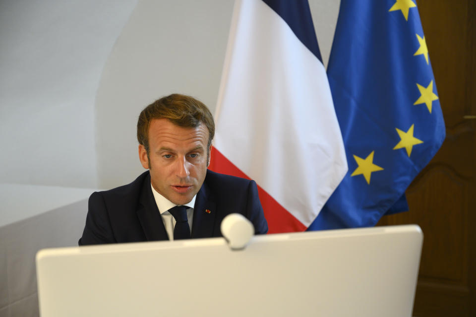French President Emmanuel Macron speaks during a video-conference on the situation in Lebanon from Fort de Bregançon, southern France, Sunday Aug. 9, 2020. French President Emmanuel Macron's organized an international conference on Sunday aiming at bringing donors together to provide emergency aid and equipment to the Lebanese population. ( Christophe Simon, Pool via AP)