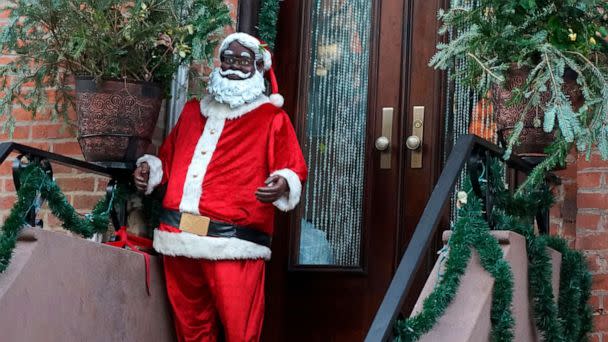 PHOTO: In this Dec. 13, 2021, file photo, a Black Santa is seen on a brownstone stoop in the Clinton Hill neighborhood of Brooklyn, N.Y. (Julia Weeks/AP, FILE)