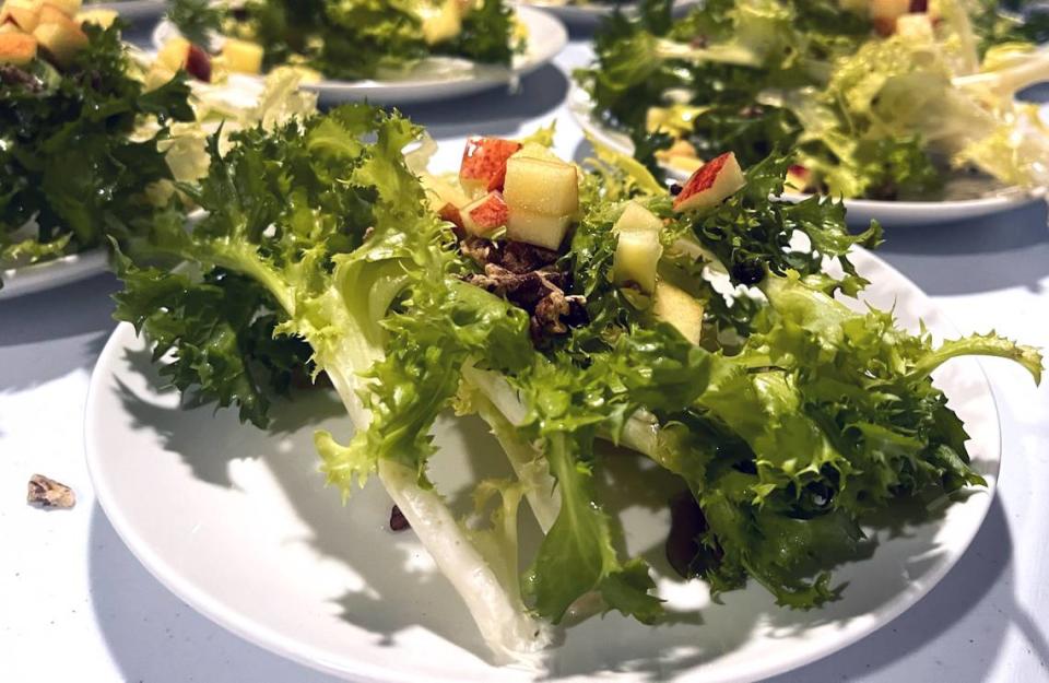 Endive, apple, peanut salads getting prepared.