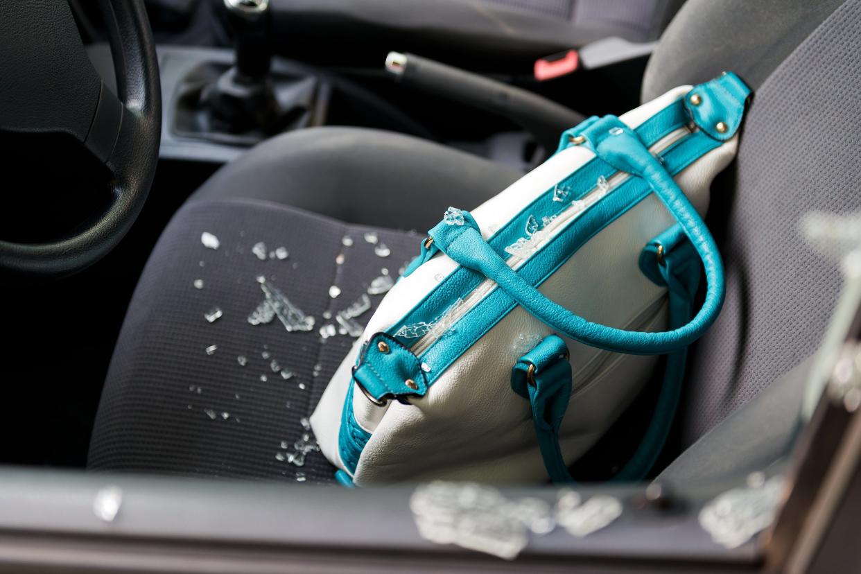 Purse in the front seat of car being broken into