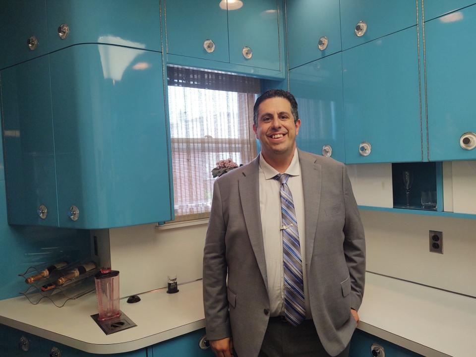 Armstrong expert Ricky Riccardi, in Louis' very blue kitchen