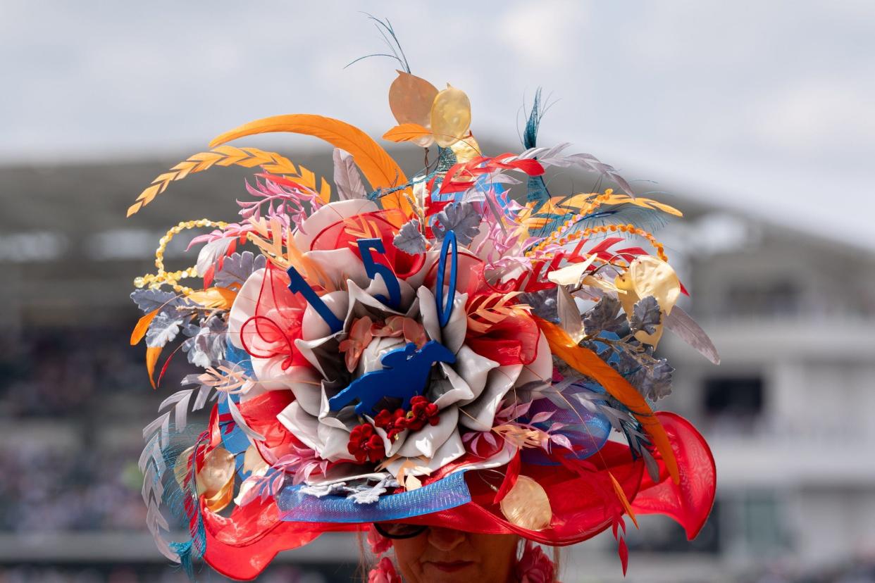 May 4, 2024; Louisville, KY, USA; Holli Bicker of Louisville wears her Derby hat during the 150th running of the Kentucky Derby at Churchill Downs. Mandatory Credit: Clare Grant-USA TODAY Sports