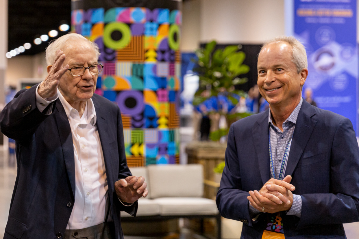 Warren Buffett, left, chairman and CEO of Berkshire Hathaway, and Kevin Clayton, CEO of Maryville-based homebuilder Clayton, attend the 2022 Berkshire Hathaway shareholders meeting in Omaha, Nebraska.