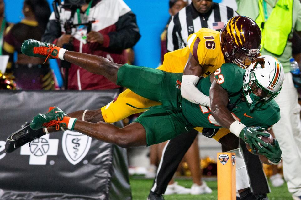 Florida A&M running back Terrell Jennings (23) stretches forward to cross the goal line for a touchdown during the Rattlers' 24-7 win over Bethune-Cookman in the Florida Classic at Camping World Stadium on Saturday, Nov. 18, 2023.