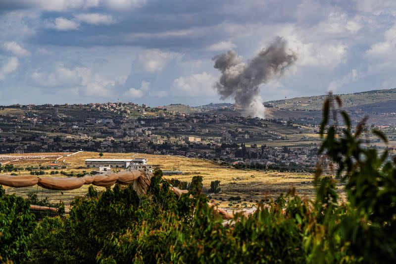 Smoke rises above Lebanon, following an Israeli strike, amid ongoing cross-border hostilities between Hezbollah and Israeli forces, as seen from Israel's border with Lebanon