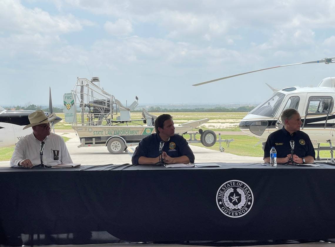 Florida Gov. Ron DeSantis and Texas Gov. Greg Abbott hold a press conference in Del Rio, Texas, in July 2021 to talk about a three-week effort by a contingent of Florida law enforcement officers to help enforce the U.S.-Mexico border. Ana Ceballos/aceballos@miamiherald.com