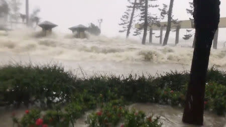 Waves caused by Typhoon Mangkhut is seen in Hong Kong, China in this still image from a September 16, 2018 video from social media. Twitter/@ALEXHOFFORD/via REUTERS