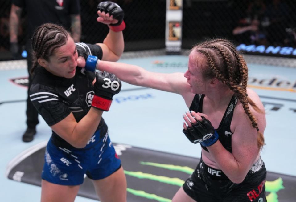 LAS VEGAS, NEVADA – OCTOBER 07: (R-L) JJ Aldrich punches Montana De La Rosa in a flyweight fight during the UFC Fight Night weigh-in at UFC APEX on October 07, 2023 in Las Vegas, Nevada. (Photo by Al Powers/Zuffa LLC via Getty Images)