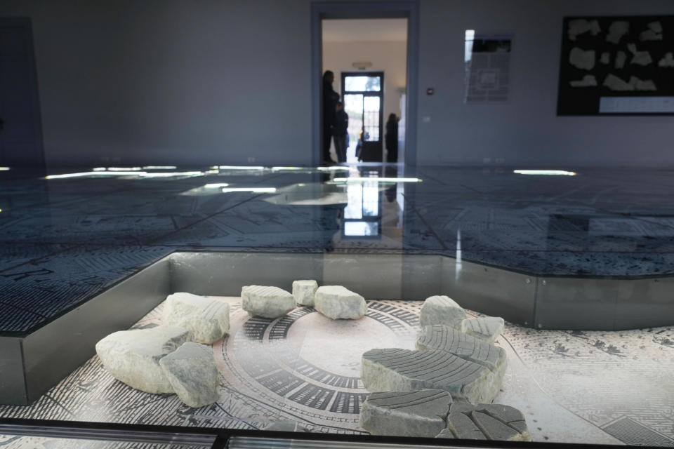 The giant marble map (Forma Urbis Romae) of the ancient Rome is shown to the media in the Archaeological Park of Mount Celio Museum overlooking the Colosseum in Rome, Thursday, Jan. 11, 2024. The giant map of Rome was done under Emperor Septimius Severus in 203 A.D. The map is 18 meters by 13 meters. (AP Photo/Gregorio Borgia)