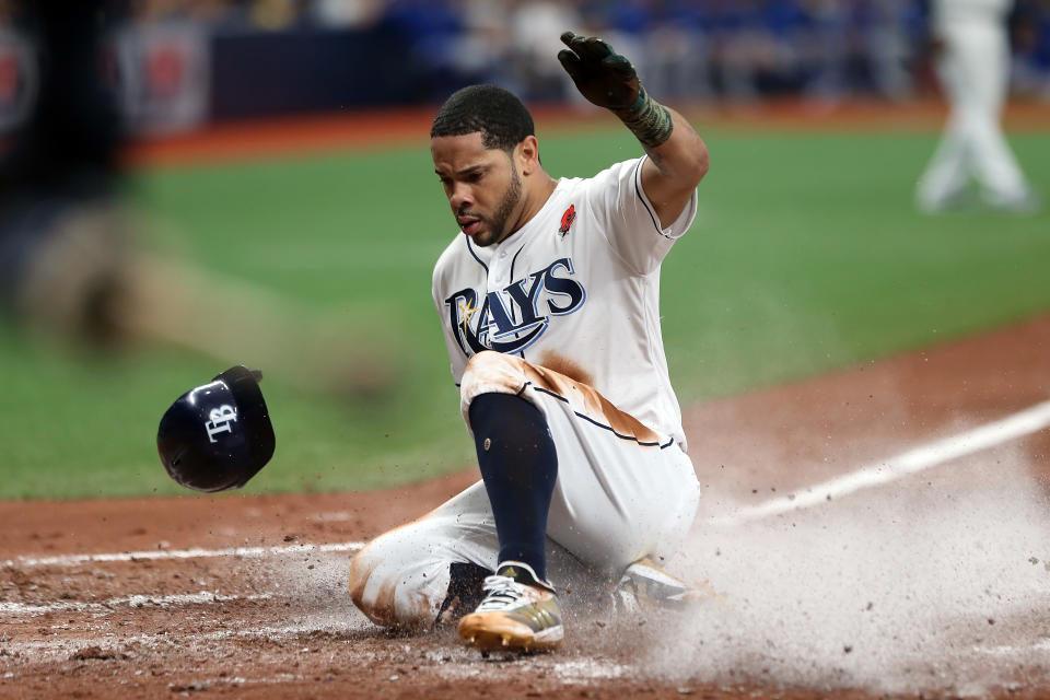 ST. PETERSBURG, FL - MAY 27: Tommy Pham (29) of the Rays slides safely home for the score during the MLB regular season game between the Toronto Blue Jays and the Tampa Bay Rays on May 27, 2019, at Tropicana Field in St. Petersburg, FL. (Photo by Cliff Welch/Icon Sportswire via Getty Images)