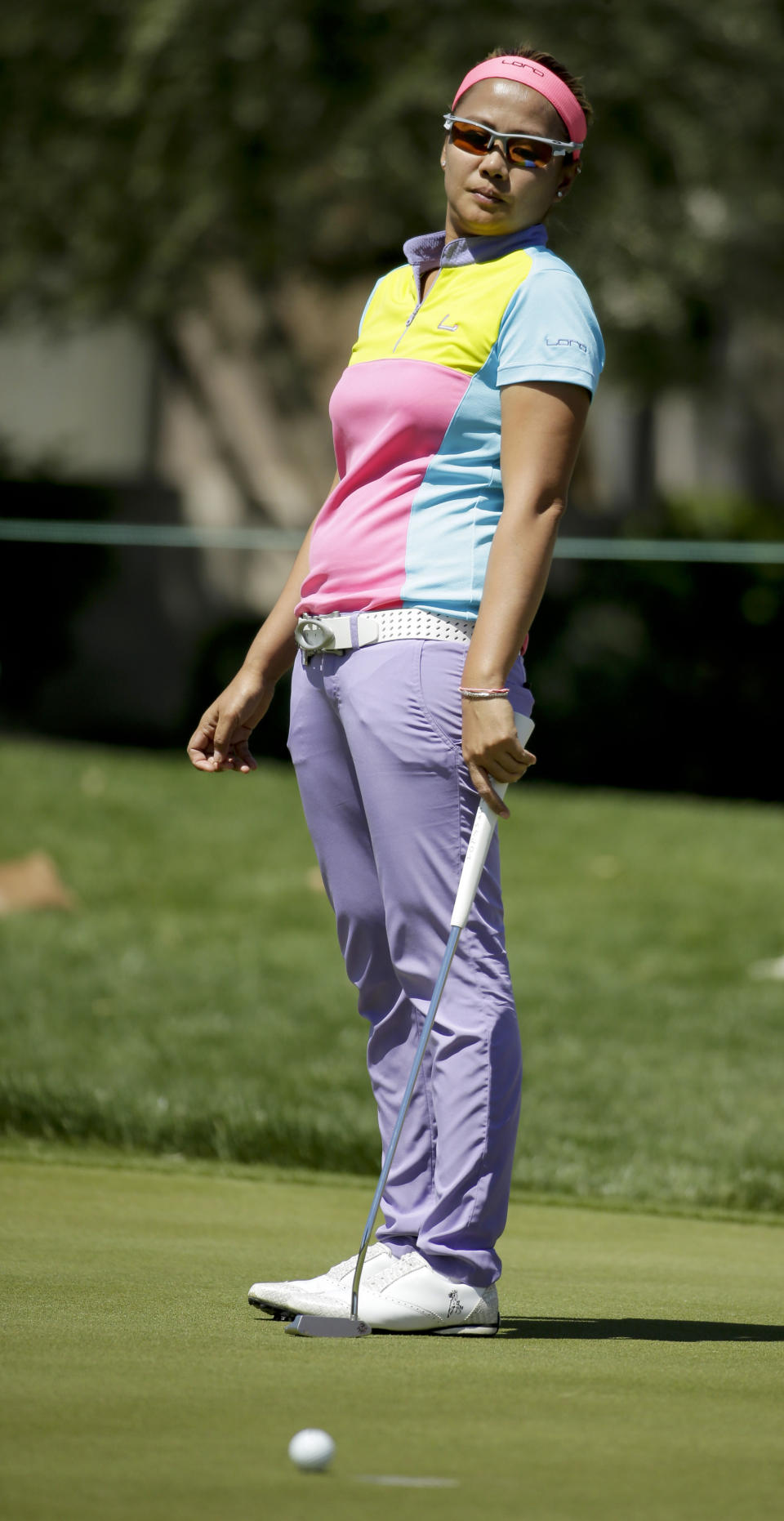 Jennifer Rosales, of the Philippines, reacts after missing a birdie putt on the ninth hole during the first round at the Kraft Nabisco Championship golf tournament Thursday, April 3, 2014, in Rancho Mirage, Calif. (AP Photo/Chris Carlson)