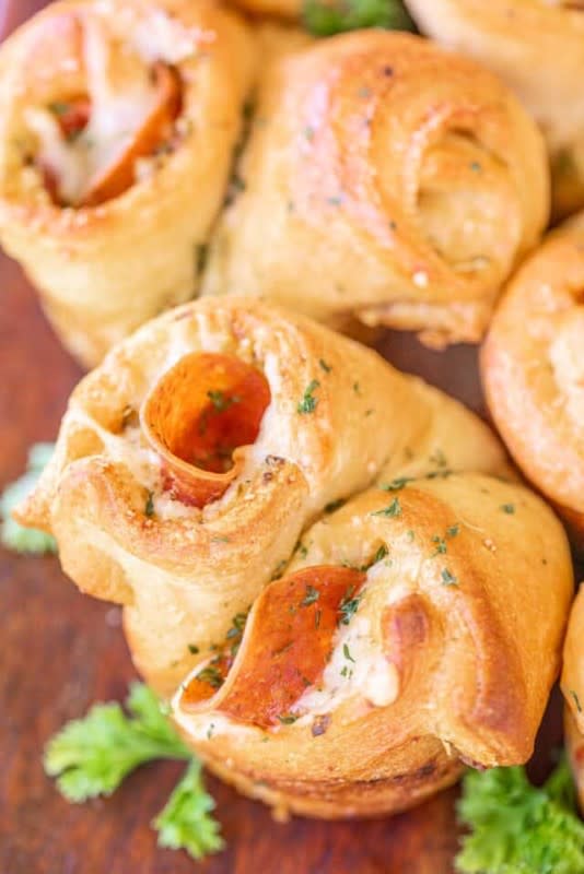 <p>Plain Chicken</p><p>So much easier than trying to balance pizza as you mingle at the party!</p><p><strong>Get the recipe: <a href="https://www.plainchicken.com/pepperoni-pesto-popovers/" rel="nofollow noopener" target="_blank" data-ylk="slk:Pepperoni Crescent Popovers;elm:context_link;itc:0;sec:content-canvas" class="link ">Pepperoni Crescent Popovers</a></strong></p><p><strong>Related: <a href="https://parade.com/843926/sheagoldstein/25-pizza-recipes-that-are-better-than-takeout/" rel="nofollow noopener" target="_blank" data-ylk="slk:65+ Best Pizza Recipes;elm:context_link;itc:0;sec:content-canvas" class="link ">65+ Best Pizza Recipes</a></strong></p>