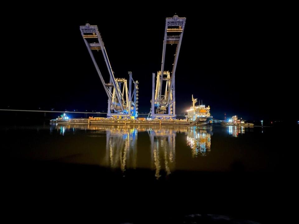 This photo of the two industrial cranes was taken earlier this year after their completion before heading out on their trek from Charleston, South Carolina, to Saint John, N.B. (DP World Canada/Twitter - image credit)