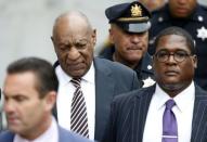 Actor and comedian Bill Cosby (2nd L) leaves with lawyer Fortunato N. Perri, Jr. (L) and spokesman Andrew Wyatt after the first day of his sexual assault trial at the Montgomery County Courthouse in Norristown, Pennsylvania, U.S. June 5, 2017. REUTERS/Brendan McDermid