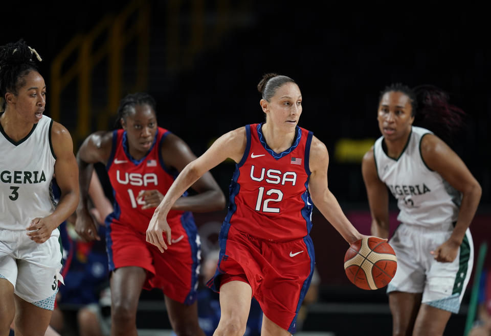 United States' Diana Taurasi (12) drives up the court during women's basketball preliminary round game at the 2020 Summer Olympics, Tuesday, July 27, 2021, in Saitama, Japan. (AP Photo/Charlie Neibergall)